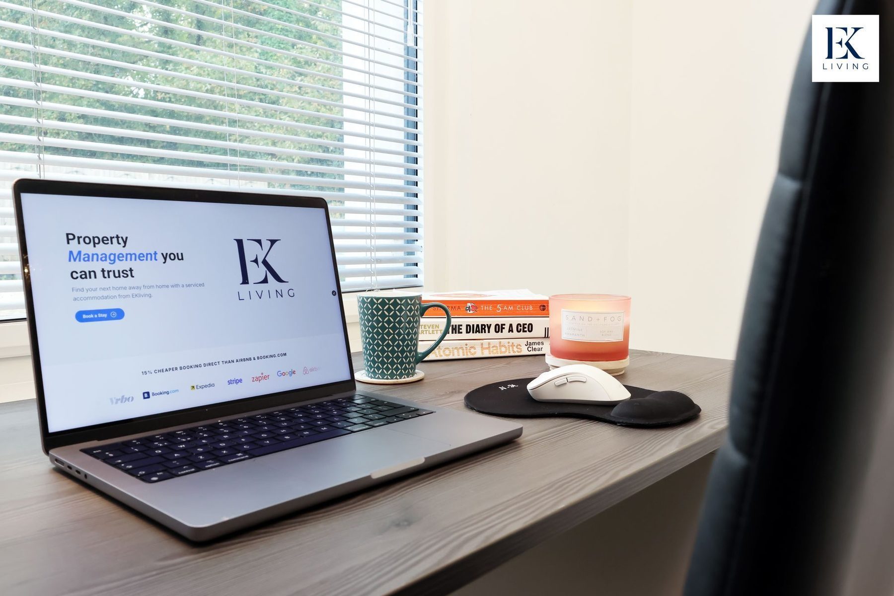A laptop on a desk in one of our properties, open on the EKLiving owner pages
